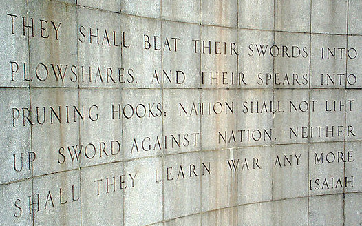 Photo of Isiaih Wall across the street from the UN in New York. 
Inscription:
“…they shall beat their swords into plowshares, and their spears into pruning hooks; Nation shall not lift up sword against nation, neither shall they learn war anymore.” (Isaiah 2-4)