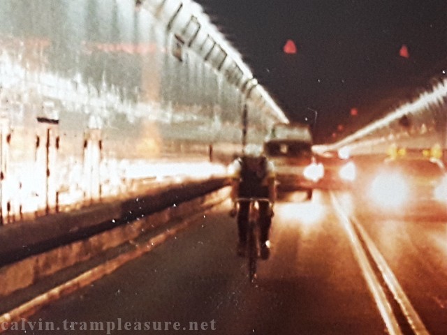 Calvin on bicycle in front of the van in the Holland Tunnel
