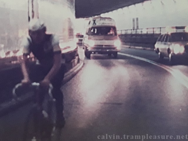 Calvin on bicycle in front of the van in the Holland Tunnel